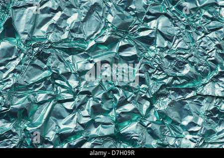 crumpled and wrinkled green metal foil background texture Stock Photo
