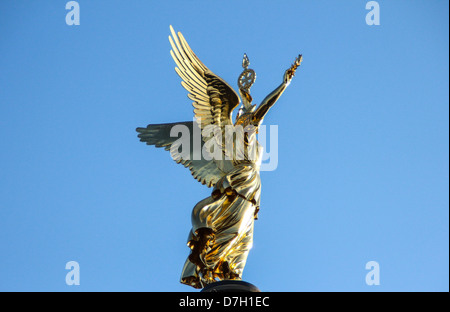 Golden angel of the Column of Victory 'Siegessäule' located in Tiergarten in Berlin, Germany Stock Photo