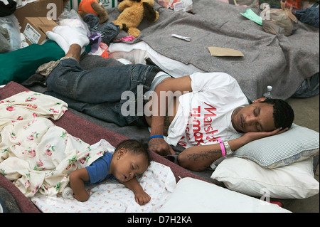 Hurricane Katrina survivors from New Orleans rest after being evacuated to a Red Cross shelter in the Houston Astrodome September 1, 2005 in Houston, TX. Stock Photo