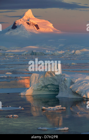 Sunset / sunrise as we travel below the Antarctic Circle, Antarctica.  Stock Photo