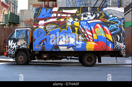 A truck with painted graffiti parked on Lafayette Street in the East Village, New York City Stock Photo