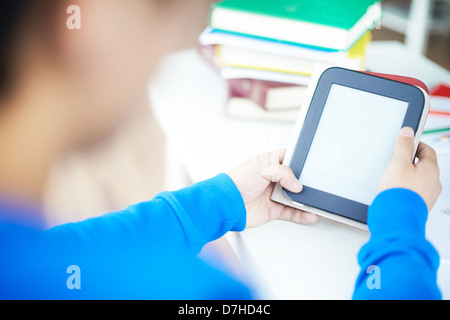 Hands of students holding and using touchpad Stock Photo
