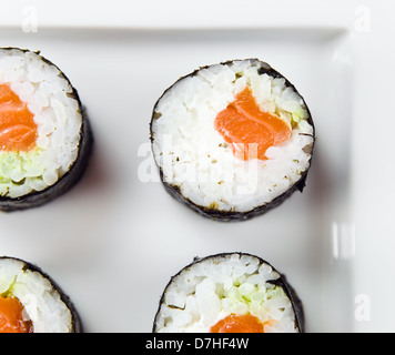 Salmon rolls on a white plate Stock Photo