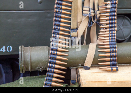 Bandoleer of machine gun Bullets draped over Bazooka (re-enactment, deactivated) Stock Photo