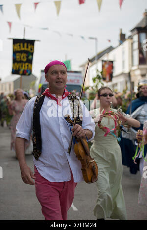 Helston, Cornwall, UK. 8th May 2013. Hal an tow also takes place on Flora Day  The colourful Pageant, known as Hal an Tow, tells the history of Helston with the participating characters singing about the challenge of the Spanish Armada, the English patron saint, St. George and the fight between St Michael and the devil. Credit:  Bob Sharples / Alamy Live News Stock Photo