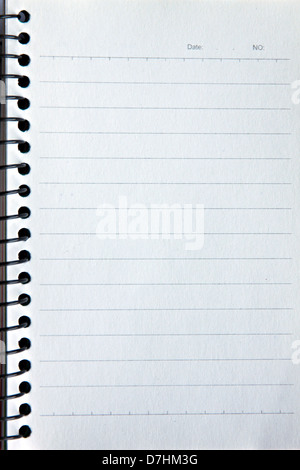 Notebook resting on a white background and the text written on the copy. Stock Photo