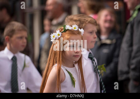 Helston, Cornwall, UK. 8th May 2013. Helston Flora day is held annually on the 8th May.  It is an ancient festival that celebrates the end of winter and mark the new spring season.  Shops and houses are decorated with floral displays.  Dances are held throughout the day and couples dance for miles along the city streets in and out of shops and houses, accompanied by the town band.  Once the big bass drum strikes at 7am the first dance commences. The childrens dance at 0940am. Credit:  Bob Sharples / Alamy Live News Stock Photo