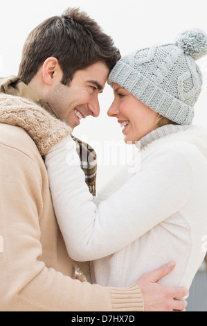 Profile of couple in winter clothing Stock Photo