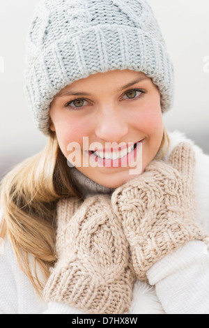 Portrait of young woman in winter clothing Stock Photo