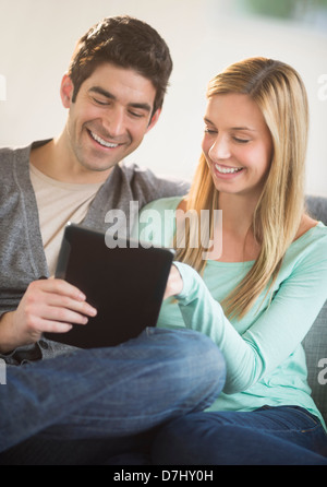 Couple using tablet pc Stock Photo