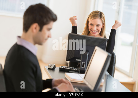 Business man and woman working in office Stock Photo