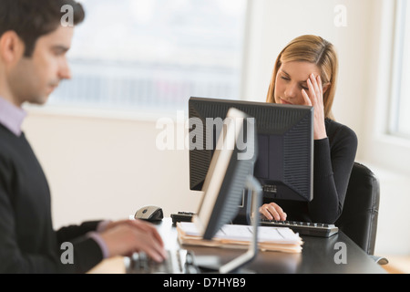Business man and woman working in office Stock Photo
