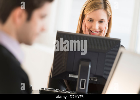 Business man and woman working in office Stock Photo
