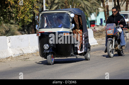 TUC-TUC & MOTOR CYCLE NEAR ASWAN EGYPT 11 January 2013 Stock Photo