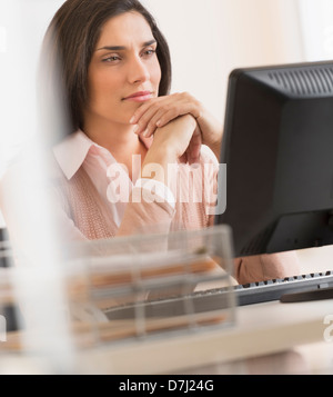 Businesswoman working on computer Stock Photo