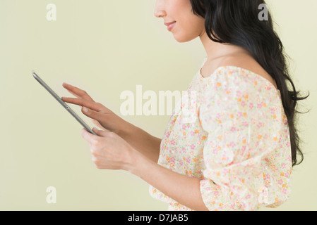 Young woman using digital tablet Stock Photo