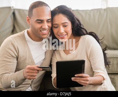 Young couple using digital tablets Stock Photo