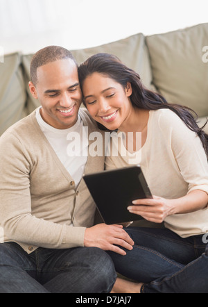 Young couple using digital tablets Stock Photo