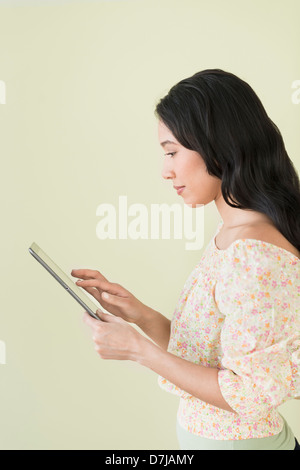 Young woman using digital tablet Stock Photo