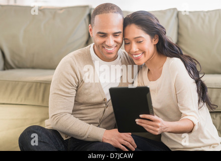 Young couple using digital tablets Stock Photo