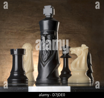 chess pieces on marble playing board Stock Photo