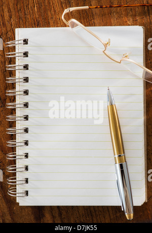 Studio Shot spiral-bound notebook and pen Stock Photo