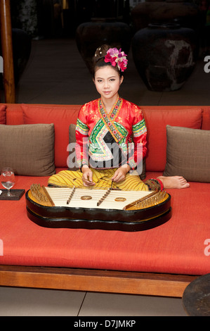 Thai girl playing khim Stock Photo