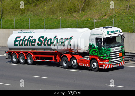 Eddie Stobart fuel tanker articulated trailer & hgv Scania lorry truck prime mover driving along on M25 London orbital motorway Essex England UK Stock Photo