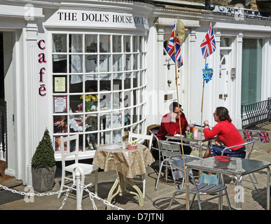 A couple having coffee at the dolls House cafe, Harrow on the Hill, London, UK Stock Photo
