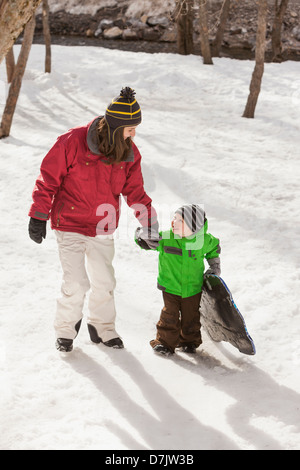 USA, Utah, Highland, Portrait of young woman with boy (4-5) during stroll Stock Photo