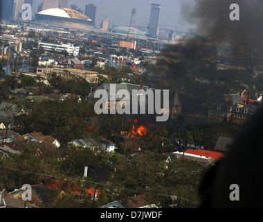 Aerial view of fires burning in a flooded neighborhood in the aftermath of Hurricane Katrina September 1, 2005 in New Orleans, LA. Stock Photo