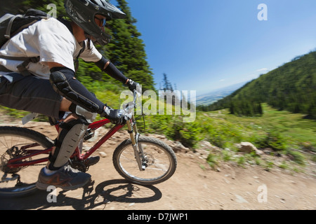 USA, Montana, Whitefish, Man mountain biking Stock Photo