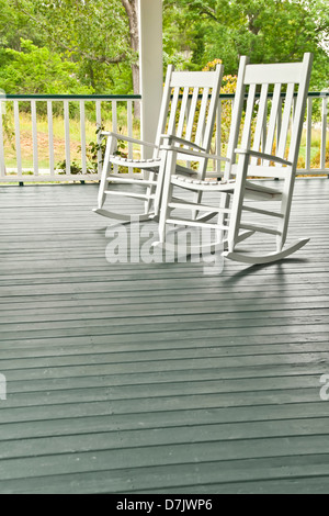 Two white rocking chairs on the front porch Stock Photo - Alamy