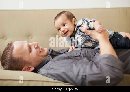 Father holding his son (2-5months) Stock Photo