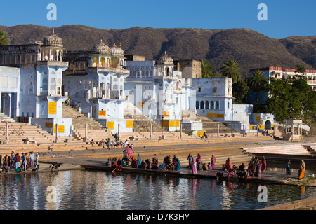 Pilgrims bathing in the holy waters of the Lake Pushkar, Pushkar, Rajasthan, India Stock Photo