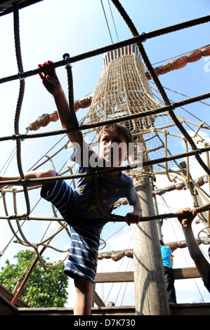 Children playing on the pirate ship in the Princess Diana memorial garden, kensington gardens,london Stock Photo