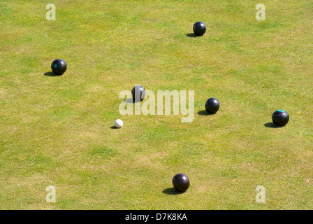 Bowling green bowls and jack during a game. Stock Photo