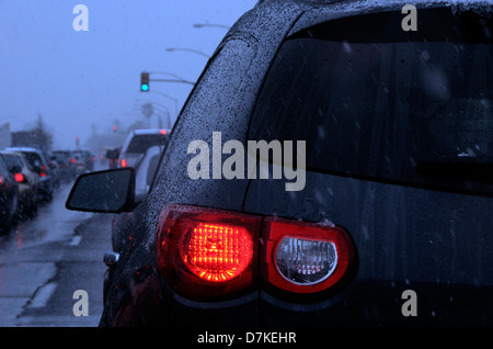 Traffic is stopped as a winter storm drops snow on Speedway Boulevard, Tucson, Arizona, USA. Stock Photo