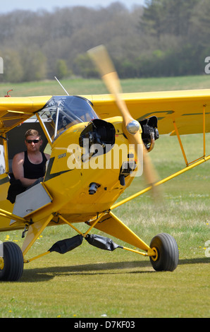 Piper J-3 Cub - a small, simple, light aircraft built between 1937 and 1947 by Piper Aircraft. In standard 'cub yellow'. Stock Photo