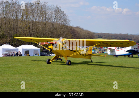 Piper J-3 Cub - a small, simple, light aircraft built between 1937 and 1947 by Piper Aircraft. In standard 'cub yellow'. Stock Photo