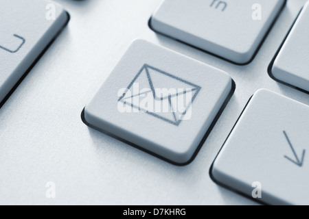 Internet email communication concept with a button on computer keyboard Stock Photo