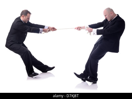 two businessmen in a tug of war isolated on white background Stock Photo