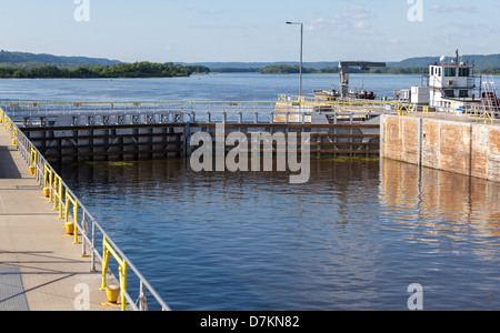 Mississippi River lock and dam number 10 in Guttenburg, Iowa regulates the flow of water south to the Gulf of Mexico. Stock Photo