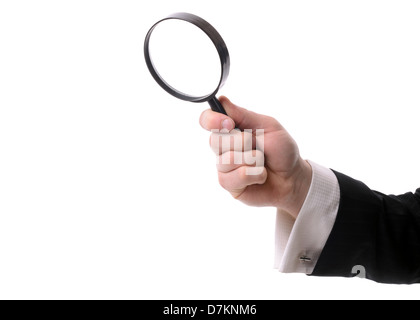 Hand holding a magnifying glass isolated on white Stock Photo