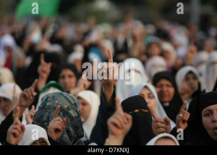 May 9, 2013 - Gaza, Gaza Strip - Palestinians attend a welcoming ceremony of Egyptian Cleric and chairman of the International Union of Muslim Scholars Sheikh Yusuf al-Qaradawi. Al-Qaradawi arrived on May 8, 2013 for his first visit to Gaza Strip with a delegation of Muslim scholars.  (Credit Image: © Eyad Al Baba/APA Images/ZUMAPRESS.com) Stock Photo