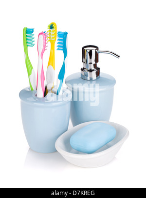 Four colorful toothbrushes and soap. Isolated on white background Stock Photo