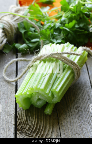 fresh celery sticks on a wooden table, rustic style Stock Photo