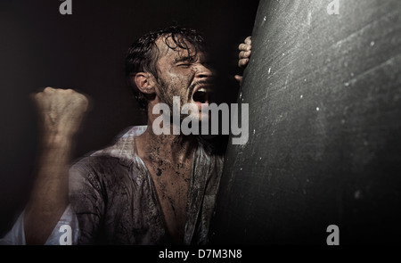 Dirtyand handsome guy in despair Stock Photo