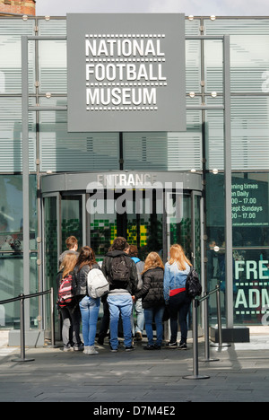 Visitors entering the National Football Museum in Manchester. Stock Photo