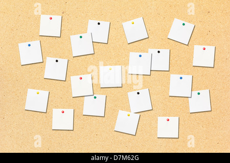 Notepad scatter on cork board Stock Photo